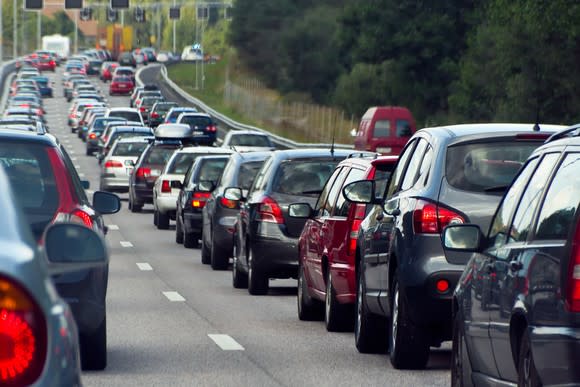 A long line of cars stuck in a traffic jam in a city