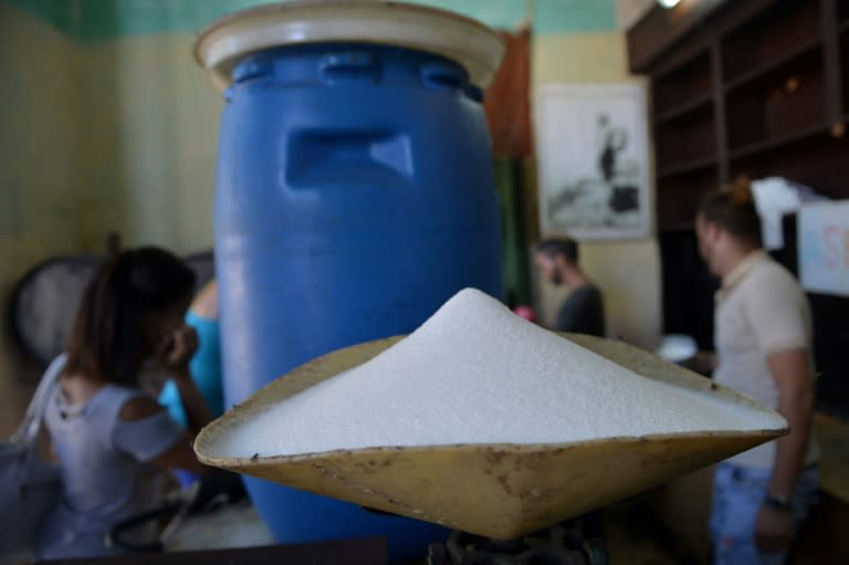 Sugar produced in France is weighed at a grocery store in Havana -- Cuba, long the world leader in sugar production, is importing the sweetener in huge quantities