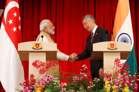 India’s Prime Minister Narendra Modi shakes hands with Singapore’s Prime Minister Lee Hsien Loong at the Istana in Singapore June 1, 2018. REUTERS/Edgar Su