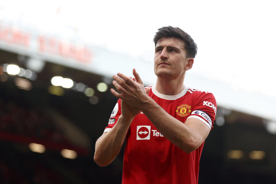 MANCHESTER, ENGLAND - APRIL 16: Harry Maguire of Manchester United applauds the fans after the Premier League match between Manchester United and Norwich City at Old Trafford on April 16, 2022 in Manchester, England. (Photo by Manchester United/Manchester United via Getty Images)