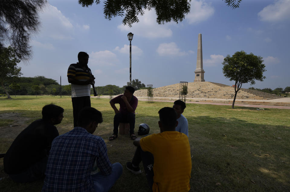 A group of band players practise in front of Proclamation tower at the Coronation Park, which houses statues of old British Kings and rulers in New Delhi, Sept. 11, 2022. India, once the largest of Britain’s colonies that endured two centuries of imperial rule has moved on. Queen Elizabeth II’s death provoked sympathies from some while for a few others, it jogged memories of a bloody history under the British crown. Among most regular Indians, the news was met with an indifferent shrug. (AP Photo/Manish Swarup)