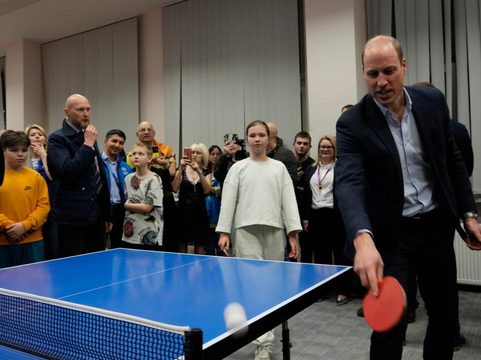 Prince William plays a game of table tennis as he visits an accommodation centre, for Ukrainians who fled the war, in Warsaw, Poland on March 22.