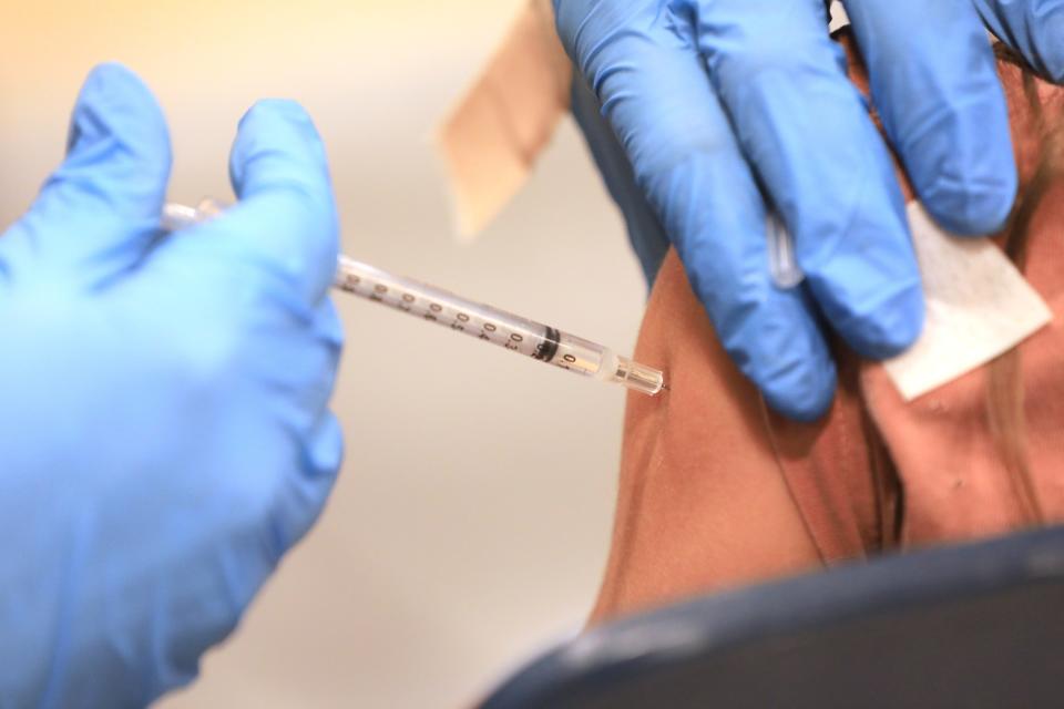 A pediatric COVID-19 vaccine is administered at Beacon High School on November 10, 2021.