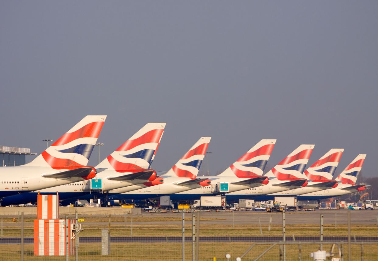 British Airways aircraft line up at an airport