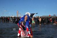 <p>Participants are seen in the water during a polar bear plunge at the beach in Coney Island, Brooklyn on Jan. 1, 2018. New Yorkers took part in new year’s day swim with temperature standing at -7 degrees Celsius. (Photo: Atilgan Ozdil/Anadolu Agency/Getty Images) </p>