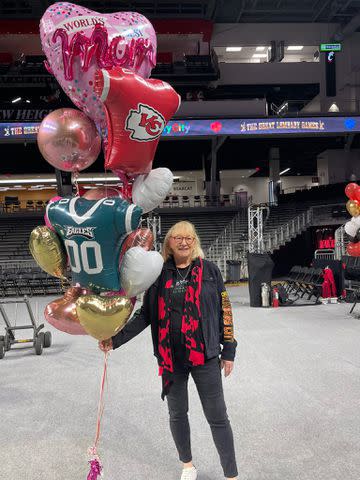 <p>New Heights/X</p> Donna Kelce holds a balloon bouquet