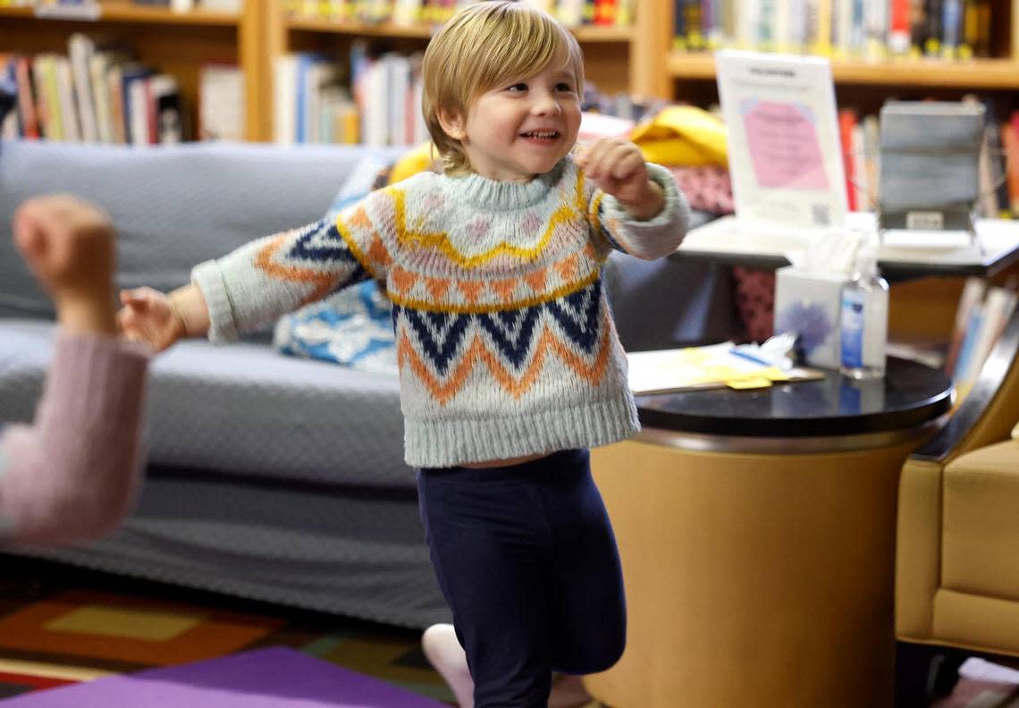 Elias Irvin, 3, participates in a yoga class for toddlers at the Fairmount Community Library on Tuesday, January 23, 2024. Brooke Blankenship, executive director and founder of Yogi Squad, leads a yoga class once a month at the library.