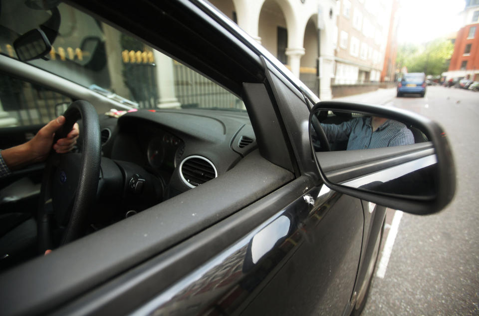 Embargoed to 0001 Monday February 04 File photo dated 13/06/11 of a driver behind the wheel of a car. According to a survey of 3,000 UK road users, carried out by Maru and Usurv and commissioned by Auto Trader, nearly one in five road users are threatened with physical violence on Britain's roads each year.