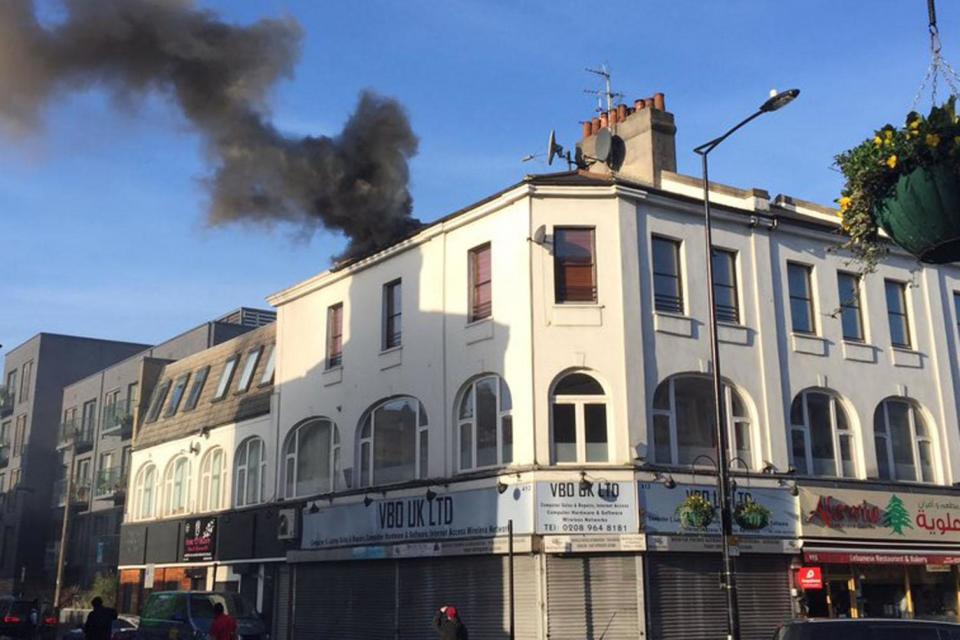 Black smoke: A shop set alight in Harrow Road, Westbourne Pa(Jamie Page/Twitter)