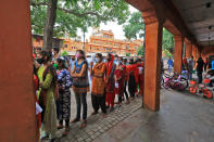 Rajasthan Basic School Training Course (BSTC) students stand outside a centre to appear for the exams amid the ongoing coronavirus pandemic, in Jaipur, Rajasthan, India, on August 31, 2020. (Photo by Vishal Bhatnagar/NurPhoto via Getty Images)