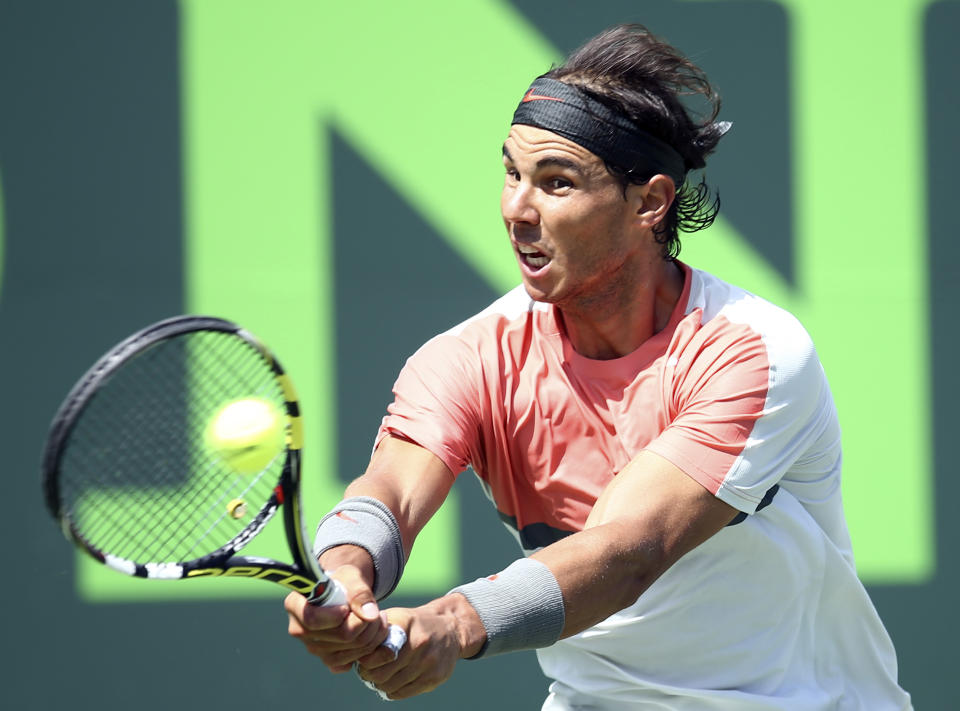 Rafael Nadal, of Spain, returns a shot from Novak Djokovic, of Serbia, during the men's final match at the Sony Open Tennis tournament on Sunday, March 30, 2014, in Key Biscayne, Fla. (AP Photo/J Pat Carter)