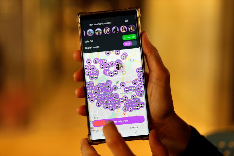 A woman presents the SafeUP, a women's safety net application, at a co-working space in Tel Aviv