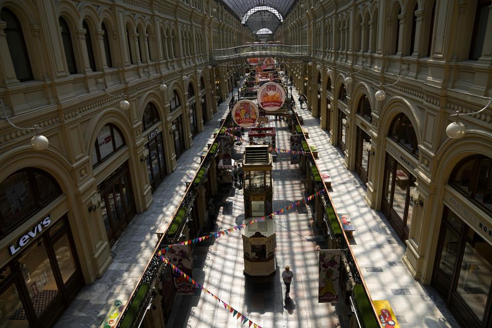 FILE - Few visitors pass inside the GUM department store with lots of boutiques closed due to sanctions in Moscow, Russia, on June 1, 2022. U.S. officials say Russia is now the most sanctioned country in the world. But as the war nears its one-year mark, it's clear the sanctions didn't pack the instantaneous punch that many had hoped. (AP Photo/Alexander Zemlianichenko, File)