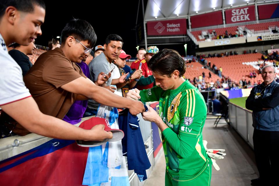 Apr 13, 2024; Sandy, Utah, USA; Columbus Crew goalkeeper Nicholas Hagen (1) signs a fans jersey after the match against Real Salt Lake at America First Field. Mandatory Credit: Christopher Creveling-USA TODAY Sports