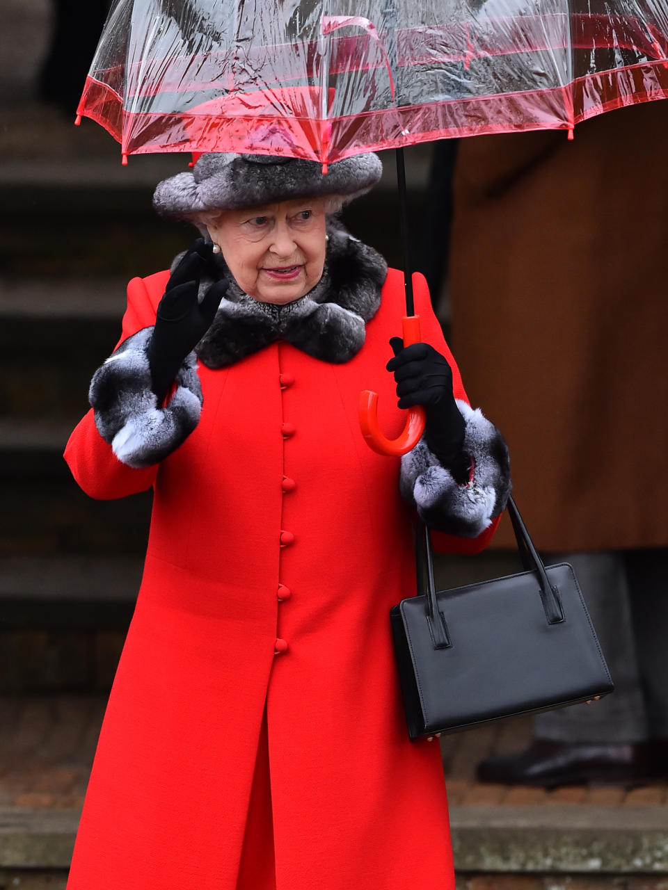 Britain's Queen Elizabeth II waves after attending a traditional Christmas Day Church Service at Sandringham in eastern England, on December 25, 2015.
AFP PHOTO / BEN STANSALL / AFP / BEN STANSALL        (Photo credit should read BEN STANSALL/AFP via Getty Images)