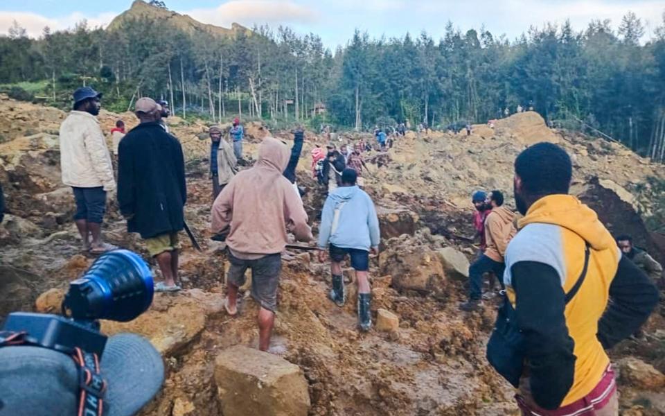 The landslide hit the village in the early hours of Friday morning