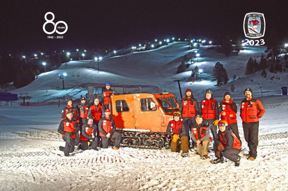 The night ski patrol crew poses with a Snowcat Imp for its 2023 annual photo.