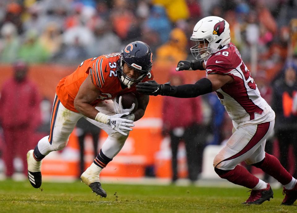 Dec 5, 2021; Chicago, Illinois, USA; Chicago Bears running back David Montgomery (32) rushes the ball against Arizona Cardinals outside linebacker Jordan Hicks (58) during the second quarter at Soldier Field. Mandatory Credit: Mike Dinovo-USA TODAY Sports