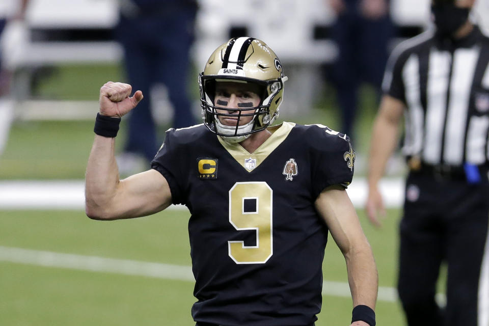 New Orleans Saints quarterback Drew Brees (9) reacts after throwing a touchdown pass to Michael Thomas against the Bears. (AP Photo/Brett Duke)