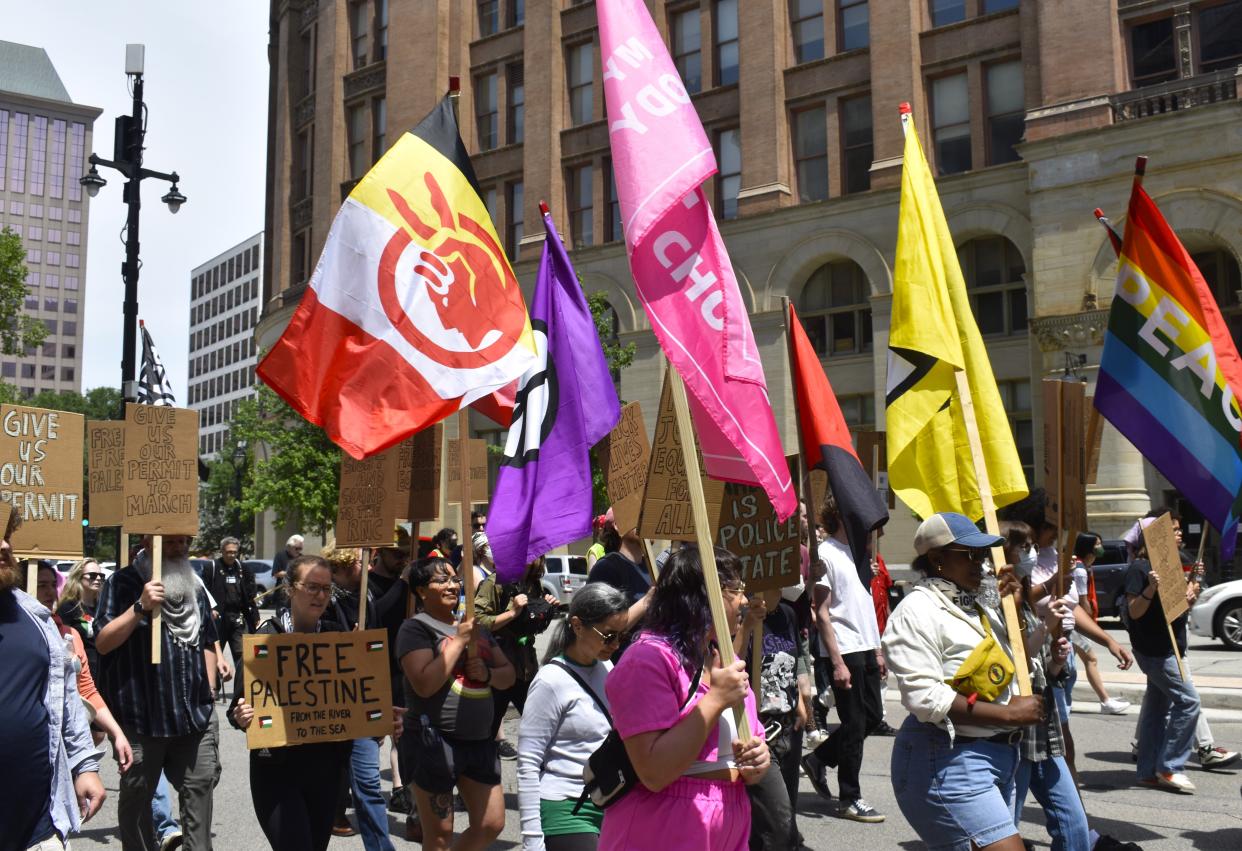 The Coalition to March on the RNC walks its desired parade route on June 15. The city rejected their application for a permit to protest on this route during the Republican National Convention on July 15.