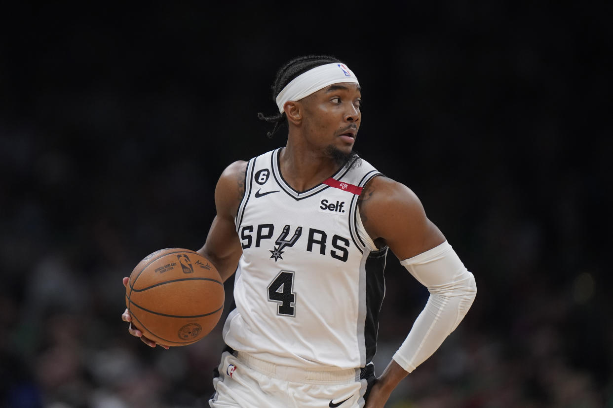 FILE - San Antonio Spurs guard Devonte' Graham runs with the ball during the second half of an NBA basketball game against the Boston Celtics, March 26, 2023, in Boston. Graham had pleaded guilty to a driving while intoxicated charge stemming from a July 2022 speeding stop, according to the Wake County (N.C.) District Attorney's office Thursday, June 29, 2023. (AP Photo/Steven Senne, File)