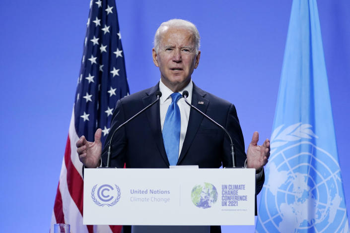 President Biden stands in front of flags at a podium that reads: United Nations Climate Change, U.N. Climate Change Conference, U.K. 2021.
