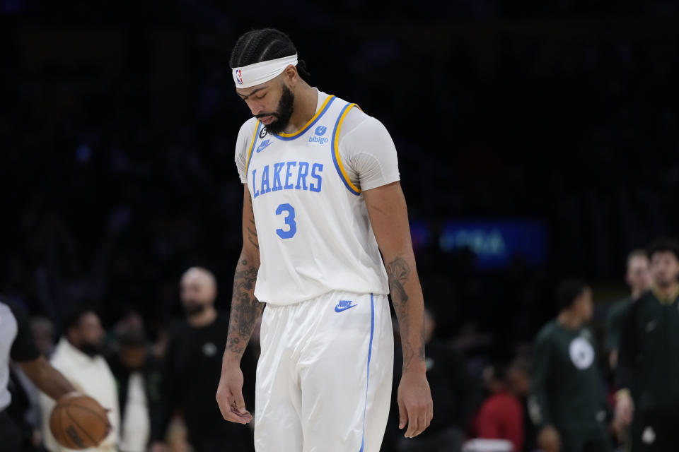 Los Angeles Lakers' Anthony Davis leaves the court after the team's 122-118 overtime loss in an NBA basketball game against the Boston Celtics Tuesday, Dec. 13, 2022, in Los Angeles. (AP Photo/Jae C. Hong)