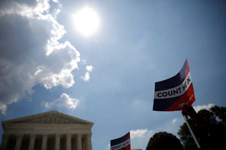 A protester holds sign outside the U.S. Supreme Court in Washington