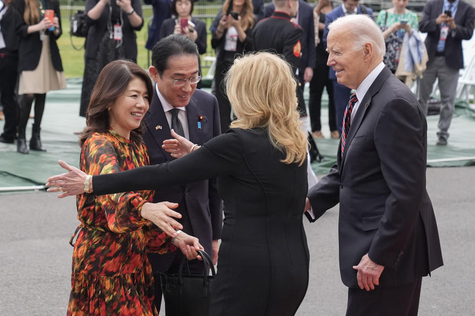 President Joe Biden, far right, and first lady Jill Biden greeting Japanese Prime Minister Fumio Kishida, second from the left, and his wife Yuko Kishida, far left, upon their arrival at the White House, Tuesday, April 9, 2024, in Washington. (AP Photo/Alex Brandon)