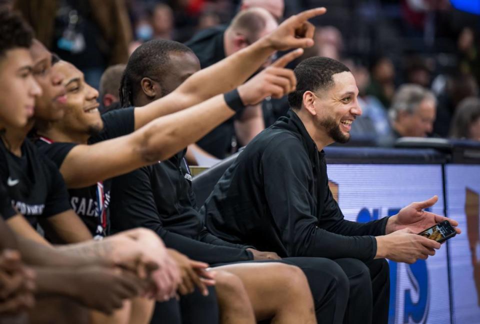 Sacramento Dragons head coach Matt Johnson smiles at the home team support after their win against the Vanden Vikings in the CIF Sac-Joaquin Section Division III high school boys basketball final game in February at Golden 1 Center in Sacramento.