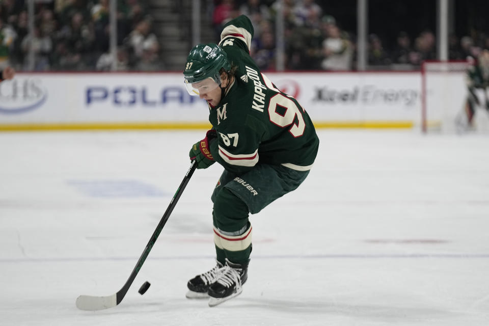 Minnesota Wild left wing Kirill Kaprizov skates with the puck during the first period of an NHL hockey game against the St. Louis Blues, Saturday, April 8, 2023, in St. Paul, Minn. (AP Photo/Abbie Parr)