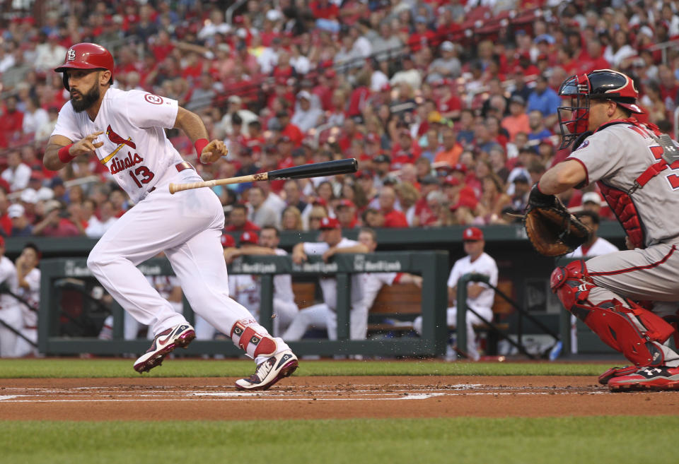 St. Louis Cardinals' Matt Carpenter (13) drops his bat after bunting as Washington Nationals catcher Matt Wieters looks on in the first inning of a baseball game, Monday, Aug. 13, 2018, in St. Louis. (AP Photo/Tom Gannam)