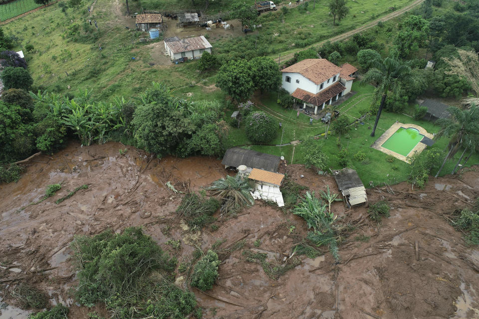 An aerial view shows a partially destroyed house after a dam collapsed, in Brumadinho, Brazil, Saturday, Jan. 26, 2019. An estimated 300 people were still missing and authorities expected the death toll to rise during a search made more challenging by intermittent rains. (AP Photo/Andre Penner)