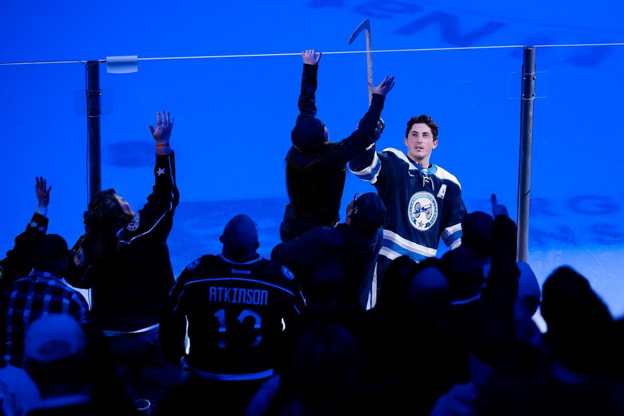 Mar 30, 2024; Columbus, Ohio, USA; Columbus Blue Jackets defenseman Zach Werenski (8) tosses out a stick after being named the game’s first star following the 4-3 shootout win over the Pittsburgh Penguins in the NHL hockey game at Nationwide Arena.