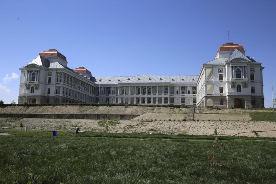 An Afghan works in the garden of the renovated Darul Aman Palace in Kabul, Afghanistan, Wednesday, April 24, 2024. (AP Photo/Siddiqullah Alizai)