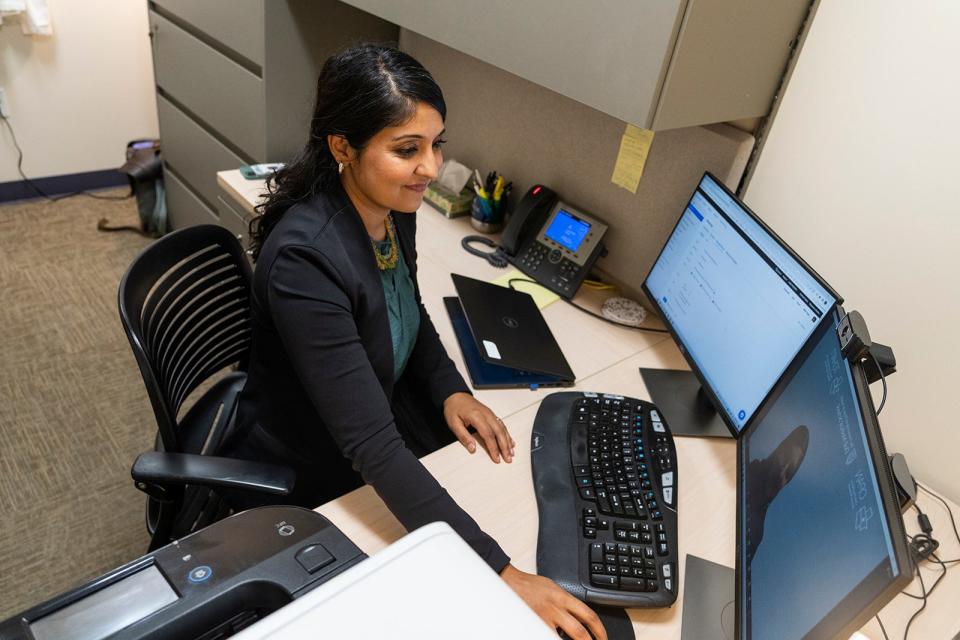 Dr. Puja Patel sets up at the Dell Children's Medical Center for a telehealth call with a student. The University of Texas Dell Medical School serves more than 303,000 students in 412 campuses across Central Texas through a telehealth program.