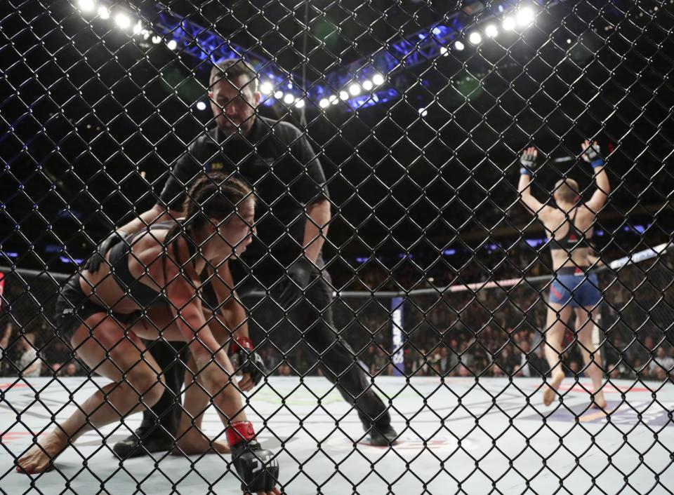Rose Namajunas (R) celebrates after knocking out Joanna Jedrzejczyk during their women’s strawweight title fight at UFC 217. (AP)