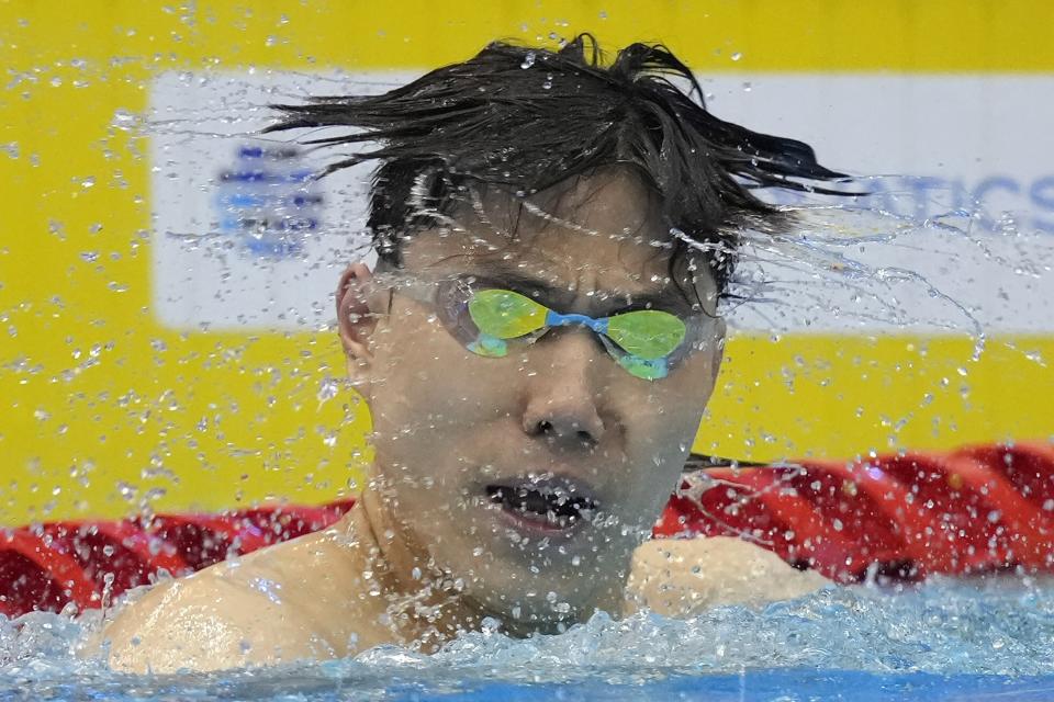 Qin Haiyang, of China, shakes his head after winning the men's 50-meter breaststroke final at the World Swimming Championships in Fukuoka, Japan, Wednesday, July 26, 2023. (AP Photo/Nick Didlick)