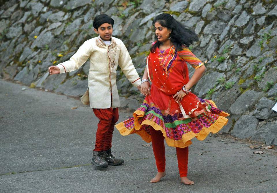 Performing a dance of their native India are Tanishk Nigotra, 6, and his sister, Srishti, 13, of Quincy, during the Quincy Multicultural Festival at Pageant Field on Thursday, May 5, 2022.