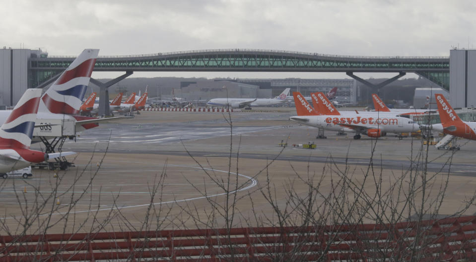 Planes are grounded at Gatwick airport, near London, as the airport remains closed with incoming flights delayed or diverted to other airports, after drones were spotted over the airfield last night and this morning, Thursday, Dec. 20, 2018. London's Gatwick Airport remained shut during the busy holiday period Thursday while police and airport officials investigate reports that drones were flying in the area of the airfield. (AP Photo/Tim Ireland)