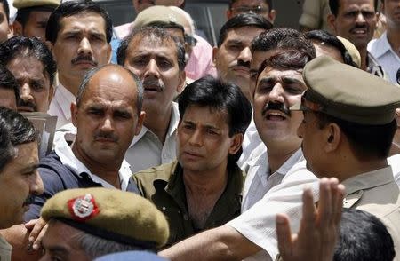 Abu Salem (C) leaves a court in New Delhi May 22, 2007. REUTERS/Adnan Abidi/Files