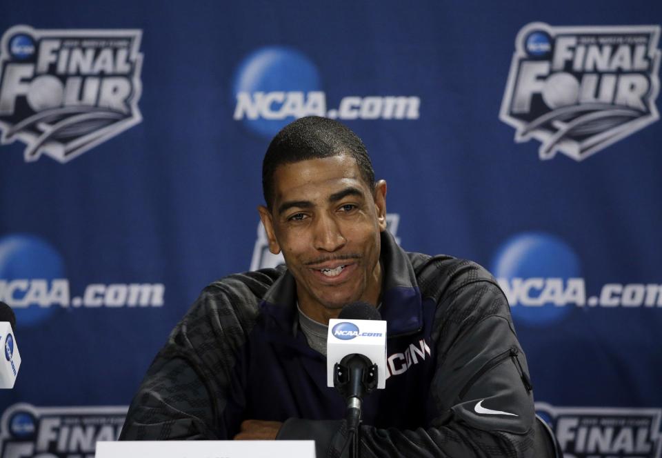 Connecticut head coach Kevin Ollie answers a question during a news conference for their NCAA Final Four tournament college basketball semifinal game Thursday, April 3, 2014, in Dallas. Connecticut plays Florida on Saturday, April 5, 2014. (AP Photo/David J. Phillip)