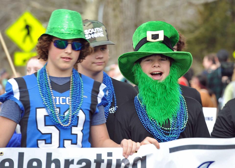 SciCoh Youth Football members are decked out for the Scituate St. Patrick's Parade, Sunday, March 20, 2022.