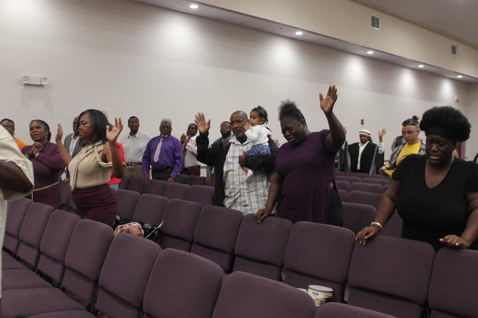 Parishioners praise the Lord during a service celebrating the 23rd anniversary of Superintendent Karl Anderson and Shepherdess Pearlie Shelton as the pastors and co-founders of Upper Room Ministries in northeast Gainesville.
(Credit: Photo by Voleer Thomas, Correspondent)