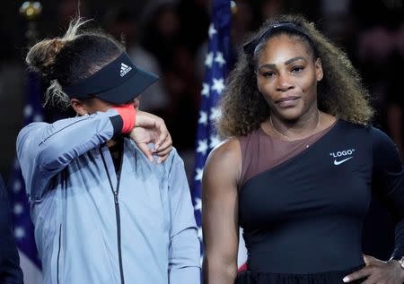 Sept 8, 2018; New York, NY, USA; Naomi Osaka of Japan (left) cries as Serena Williams of the USA comforts her after the crowd booed during the trophy ceremony following the women’s final on day thirteen of the 2018 U.S. Open tennis tournament at USTA Billie Jean King National Tennis Center. Mandatory Credit: Robert Deutsch-USA TODAY Sports