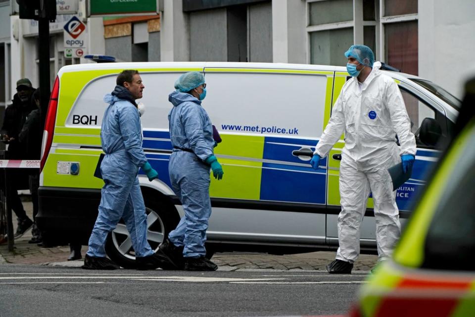 Metropolitan Police officers at the scene on Chippenham Road, Maida Vale, west London, where a woman has been stabbed to death and a man killed after being hit by a car (Aaron Chown/PA) (PA Wire)