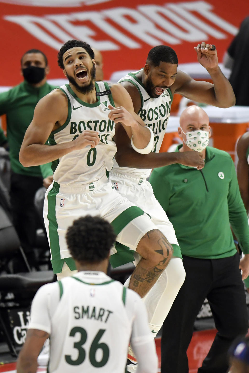 Boston Celtics' Jayson Tatum, left, and Tristan Thompson celebrate after a 122-120 win over the Detroit Pistons in an NBA basketball game, Sunday, Jan. 3, 2021, in Detroit. (AP Photo/Jose Juarez)