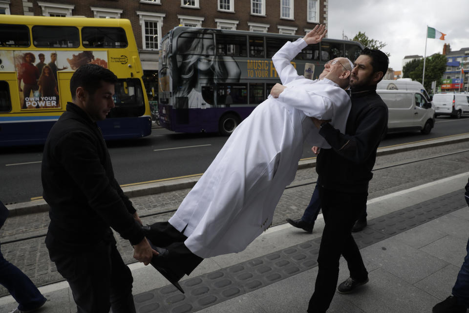<p>A recently unveiled waxwork of Pope Francis is carried from the National Wax Museum to be put on a refurbished 1979 popemobile in Dublin, Ireland, Friday, Aug. 24, 2018. (Photo: Matt Dunham/AP) </p>