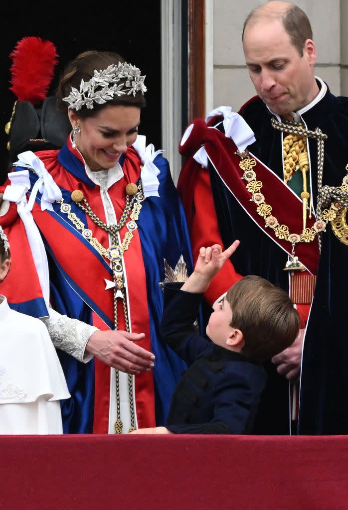 Prince Louis pointing at the sky and talking to mother Princess Kate