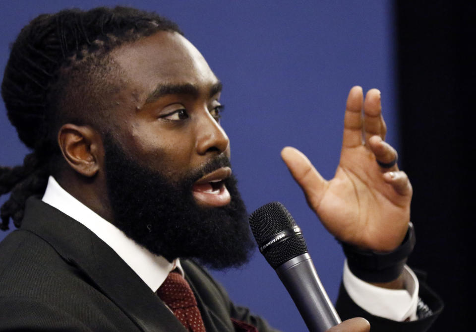 New Orleans Saints linebacker Demario Davis, a member of the Players Coalition Board, speaks about criminal justice reform efforts he has been involved in during a forum on criminal justice reform, at the Mississippi Summit on Criminal Justice Reform in Jackson, Miss., Tuesday, Dec. 11, 2018. The meeting was put on by a coalition of groups that favor changes to reduce harshness in the criminal justice system. Among issues lawmakers could consider are spending more on re-entry programs to help people coming out of prison from returning and setting up a statewide public defender system. (AP Photo/Rogelio V. Solis)